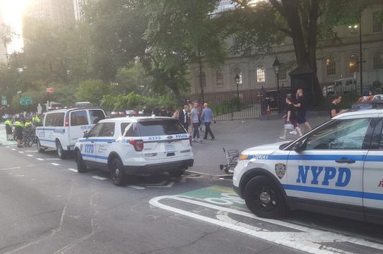 You say "bike lane," the NYPD says "parking lot." Tomato, tomahto.